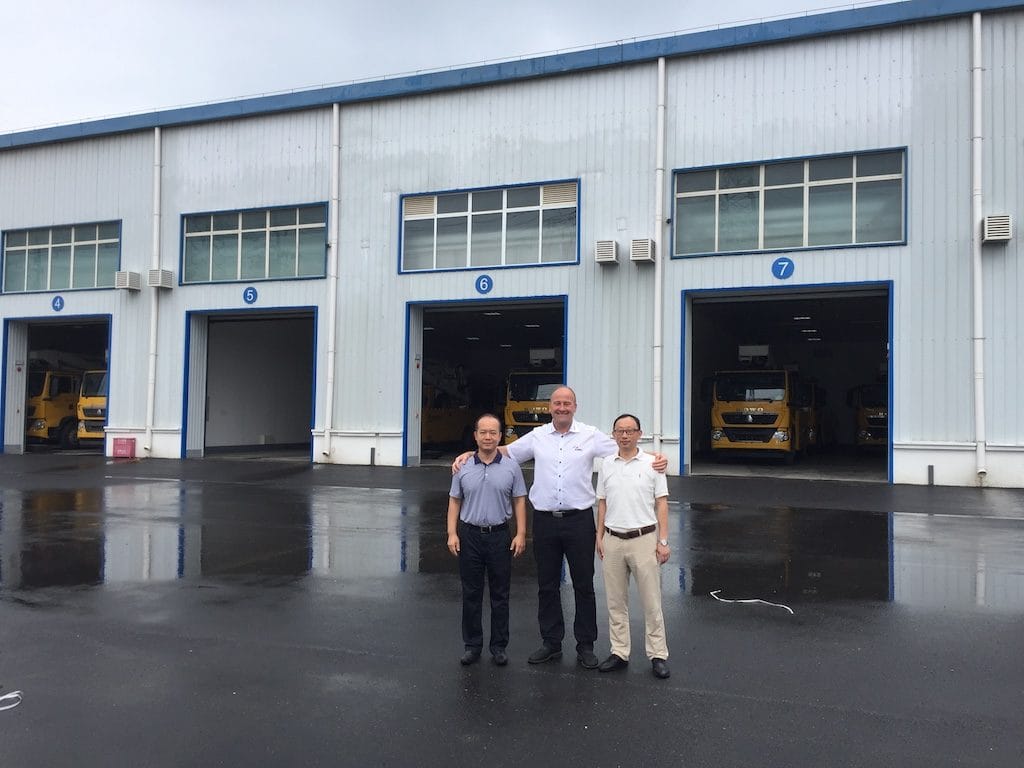 Director of Hotline Working Center Beijing, Mr. Zhao Wei, posing with GM of Qingte Special Vehicle Division, Mr. Xu, and Time International Director of Sales Mr. Torben Pederson
